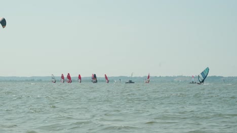 windsurfers having fun in a light breeze