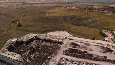 pile of debris and ashes left of the dhl industrial building at the site in toledo, spain