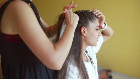 woman getting her hair braided