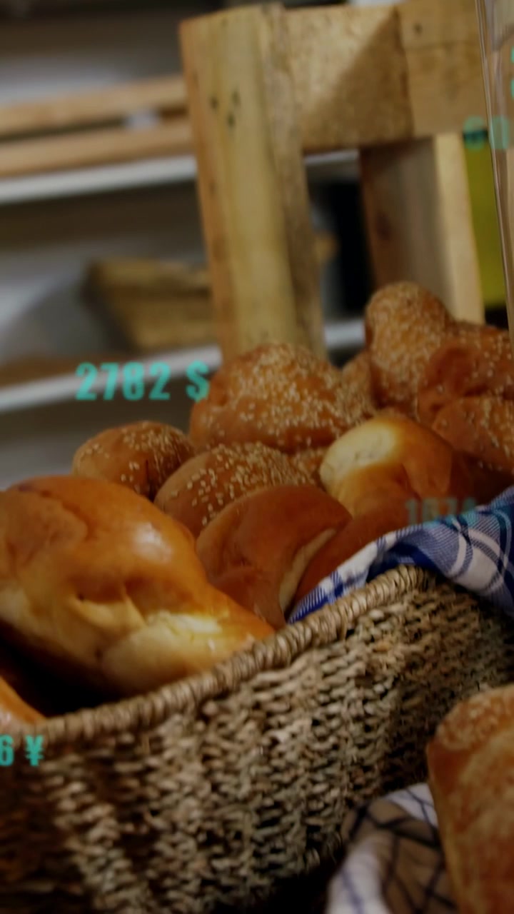 Vertical video: Floating price labels driving camera pan down revealing bread basket showing prices