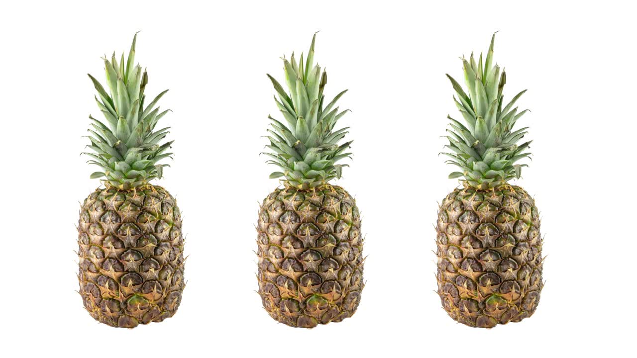 stop motion animation with three ripe fresh pineapples rotating on white background. concept of travel with copy space