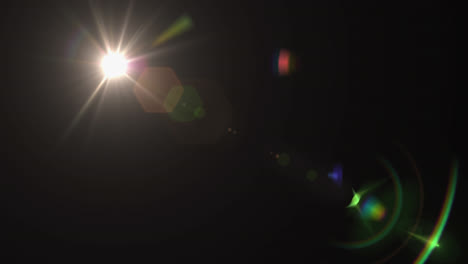 digitale animation von lichtpunkten und linsenflare vor schwarzem hintergrund