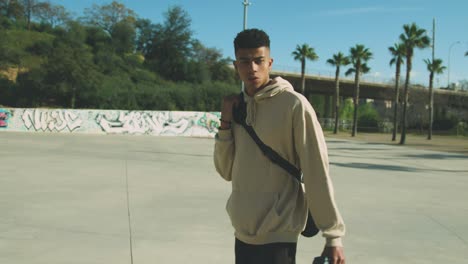 black skater walking in park