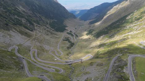 mountain road transfagarasan in carpathians, romania, europe - aerial 4k tilting up