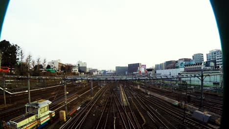 time lapse of trains going by at the tokyo train staion