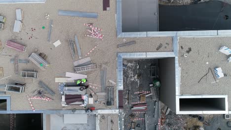 new building construction. construction workers in the roof