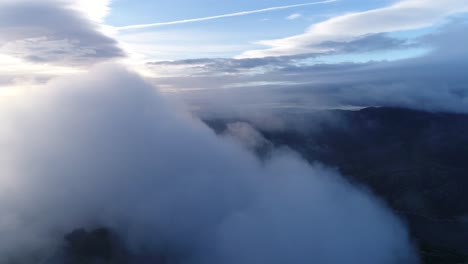 fly above mountains and clouds