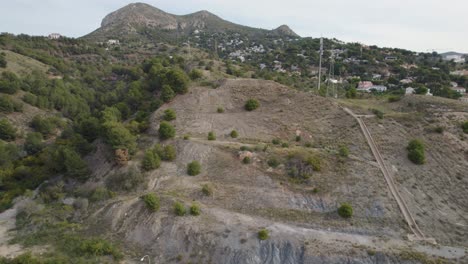 Drone-aerial-landscape-view-highway-cars-traffic-transport-road-town-suburb-apartment-units-building-town-suburban-residential-housing-architecture-Málaga-Pedregalejo-Spain