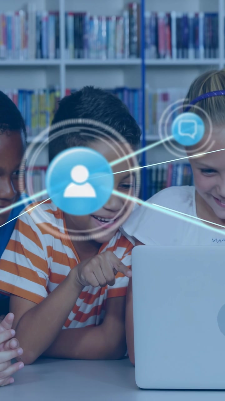 Vertical video: Boy pointing at silver laptop kids leaning in blue network expanding for school