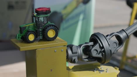 toy tractor displayed on agricultural machinery