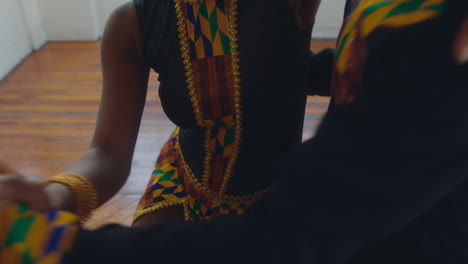 tango dancers rotating in an embrace in dance studio