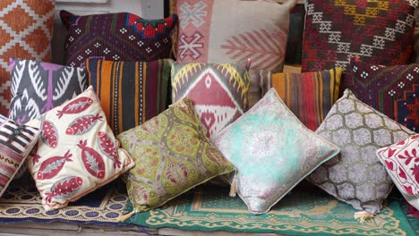 colorful and patterned pillows for sale in a turkish market