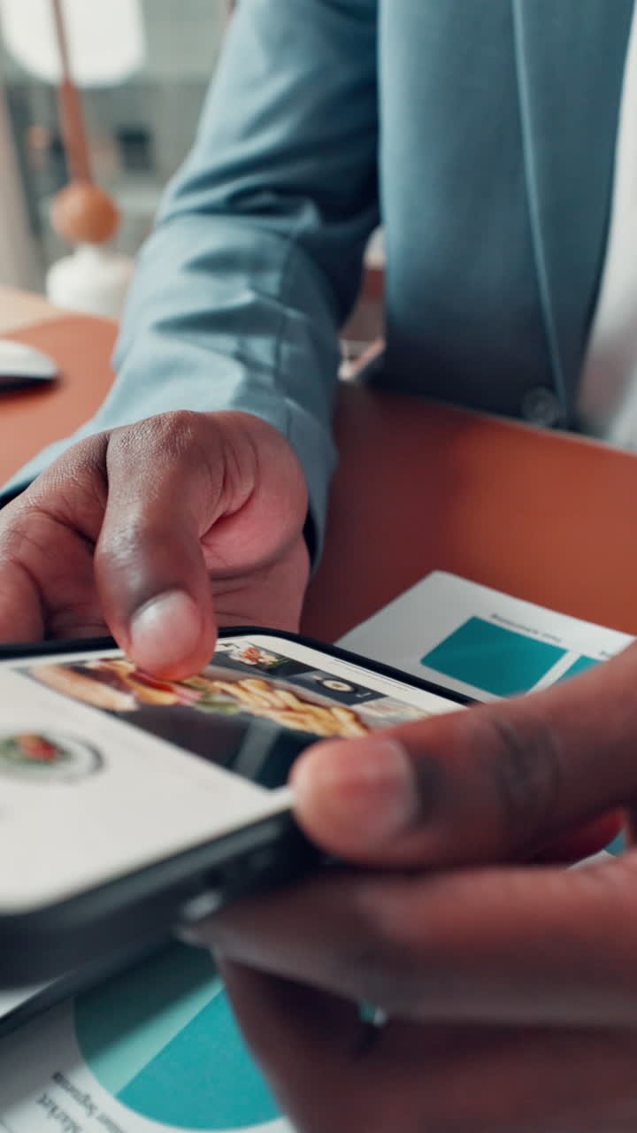Close-Up of Person's Hands Scrolling Through Images on Smartphone