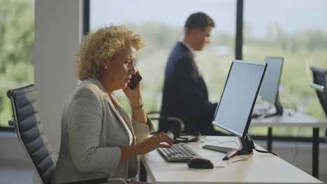 business woman on phone in office