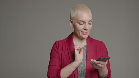 female model posing with smartphone during studio portrait 01