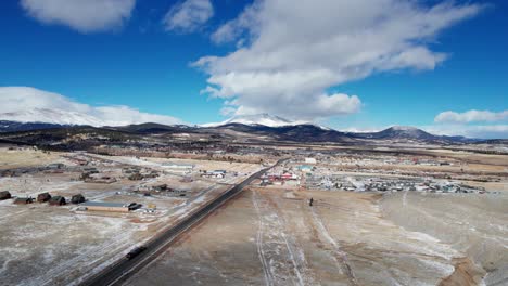 Drone-view-of-a-cloudy-day-over-Fairplay,-Colorado-in-the-winter