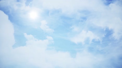 blue sky with white clouds and sun