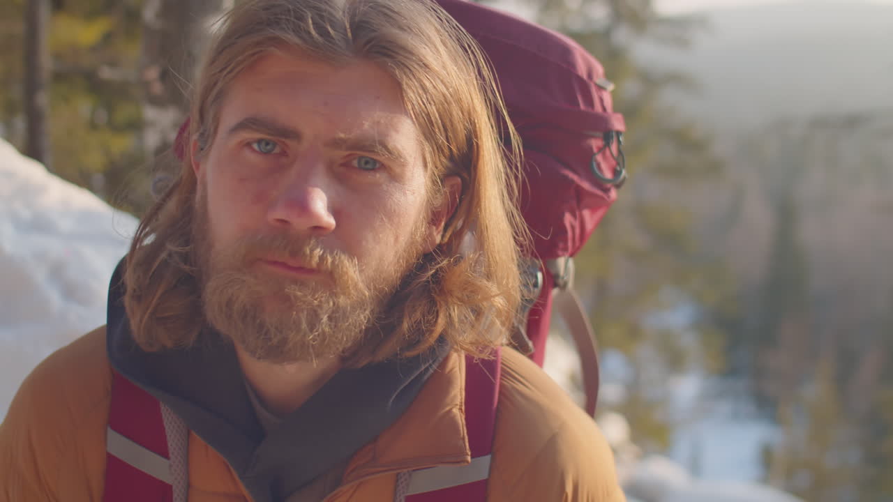 Portrait of Male Tourist on Mountain on Winter Day
