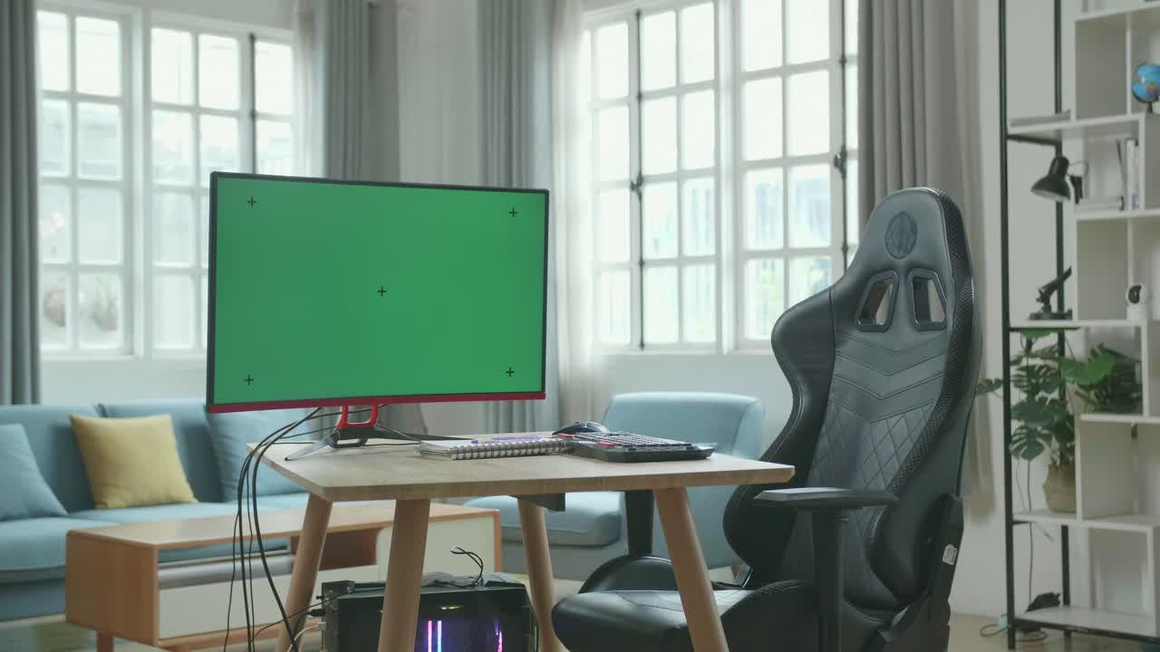 Green Screen Desktop Computer On A Table With A Chair In The Working Room At Home.