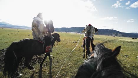 riding with kazakh golden eagle hunters on horses over altai mountains plains