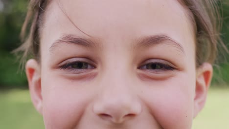 Portrait-of-happy-caucasian-girl-looking-at-camera-and-smiling