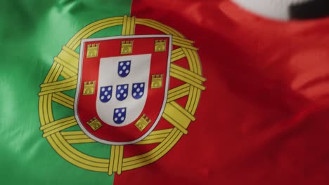 Animation-of-football-over-flag-of-portugal-with-copy-space