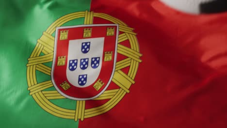 animation of football over flag of portugal with copy space