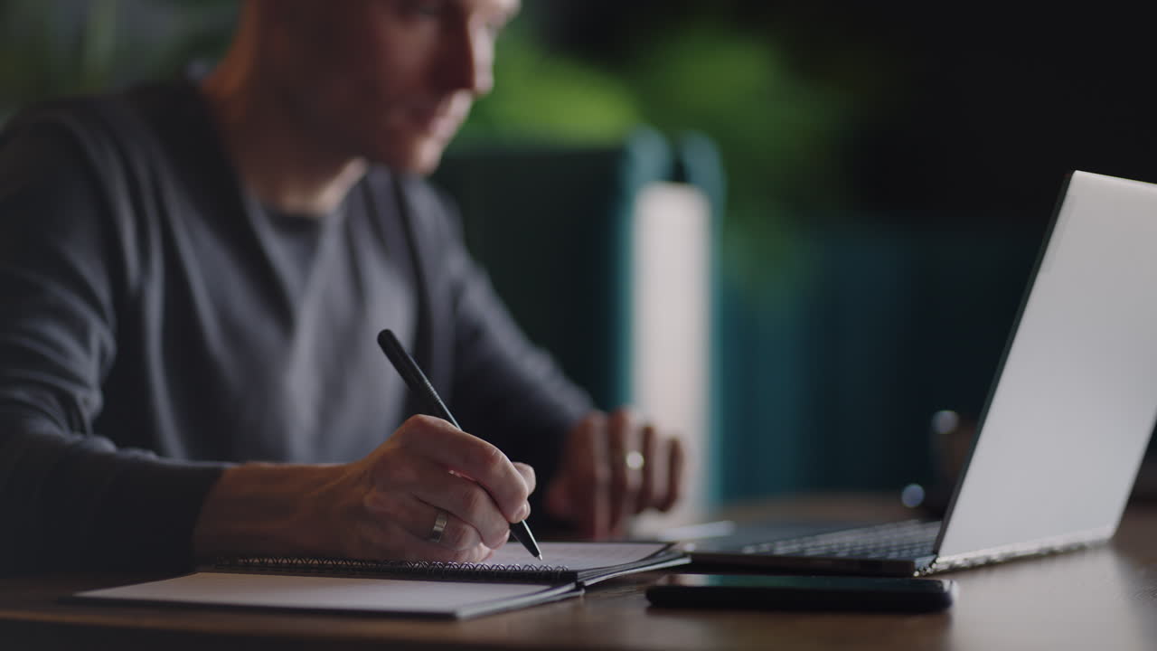 Hispanic latin man college student using laptop computer watching distance online learning seminar class remote university webinar or having virtual classroom meeting in university creative space.