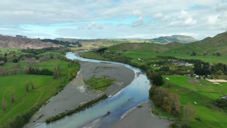 tukituki river meandering through new zealand countryside with te mata peak