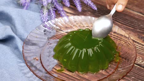 green jelly dessert with spoon