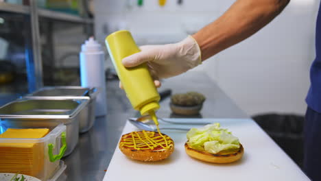 process making of burger. chef making beef burgers indoor at restaurant kitchen