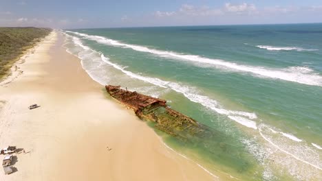 an old shipwreck is seen washed up on a beach of fraser island off the coast of queensland australia