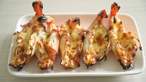 grilled river prawns or shrimps with cheese - seafood style