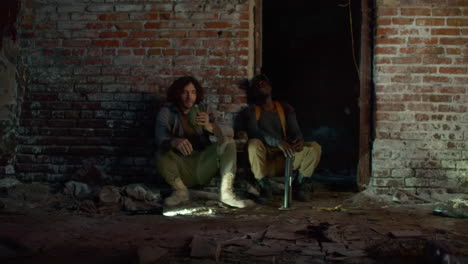 men drinking from canteen