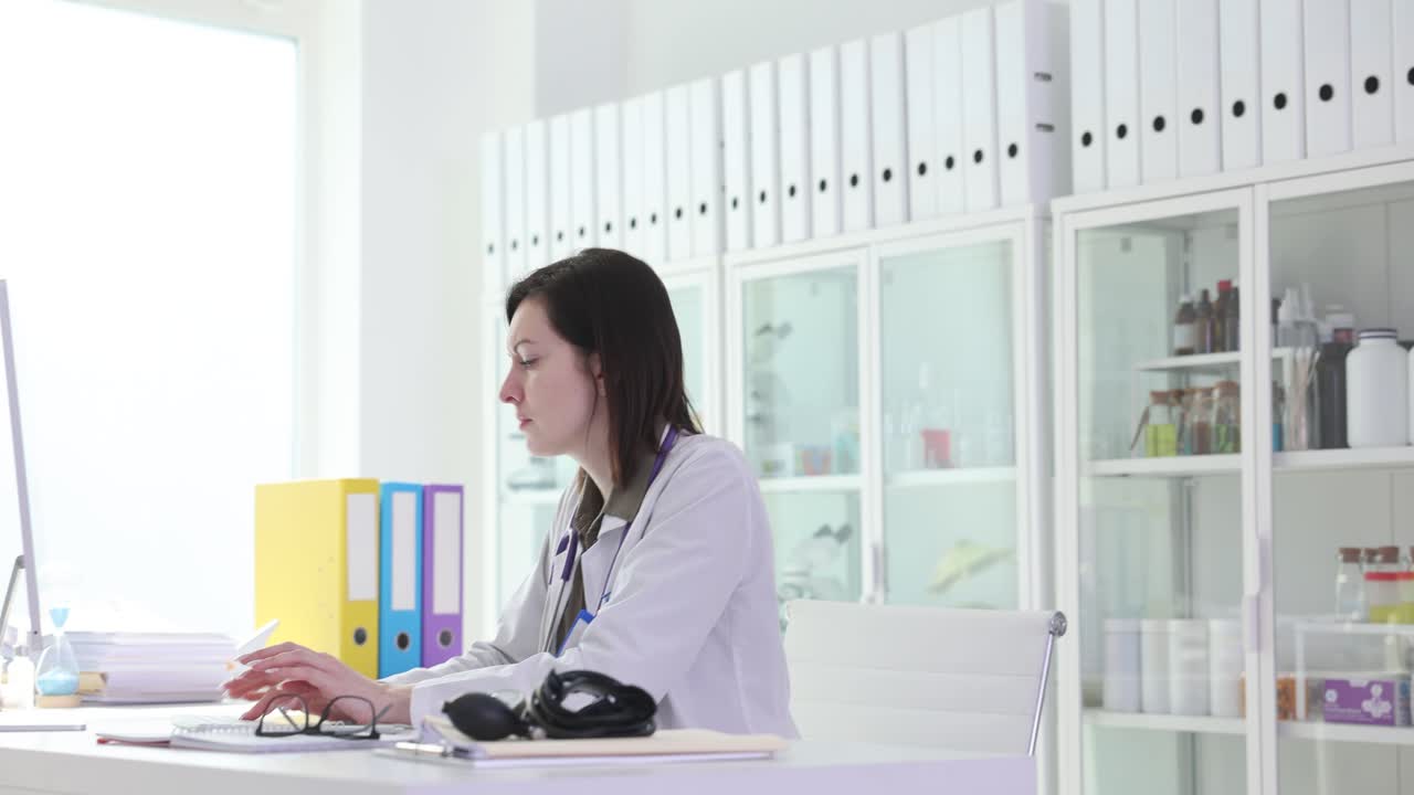 Female doctor working and thinking in a medical office