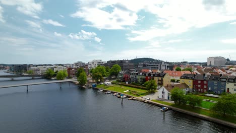 drone reveal shot of kristiansand city center, old white houses as well as a nice city structure