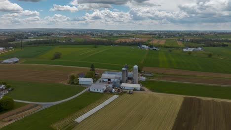 Aerial-time-lapse-of-American-farm-on-bright-spring-day