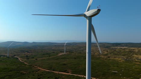 Slow-aerial-dolly-past-a-large-wind-turbine-plant-in-the-French-countryside