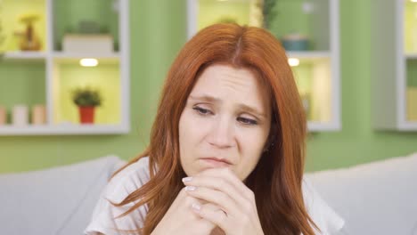 desperate thoughtful woman alone and sad at home.