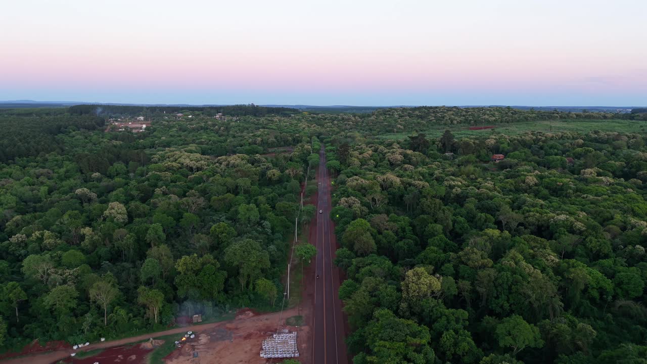 Aerial Drone fly Along Route 12 Endless Green forested road trip in Misiones Argentina