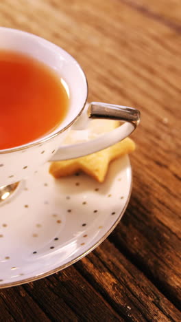 cup of coffee with cookies