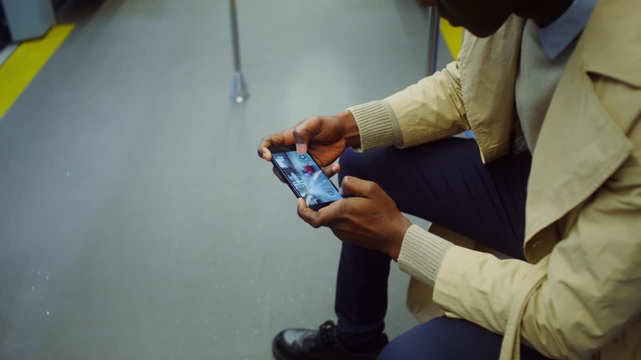 Man using smartphone on train