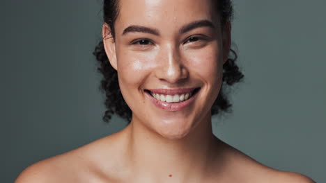 portrait of a smiling woman with curly hair