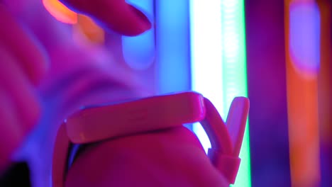 woman using wearable white smart watch at interactive exhibition - close up view