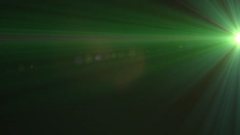 Glowing-green-rays-of-light-moving-against-black-background