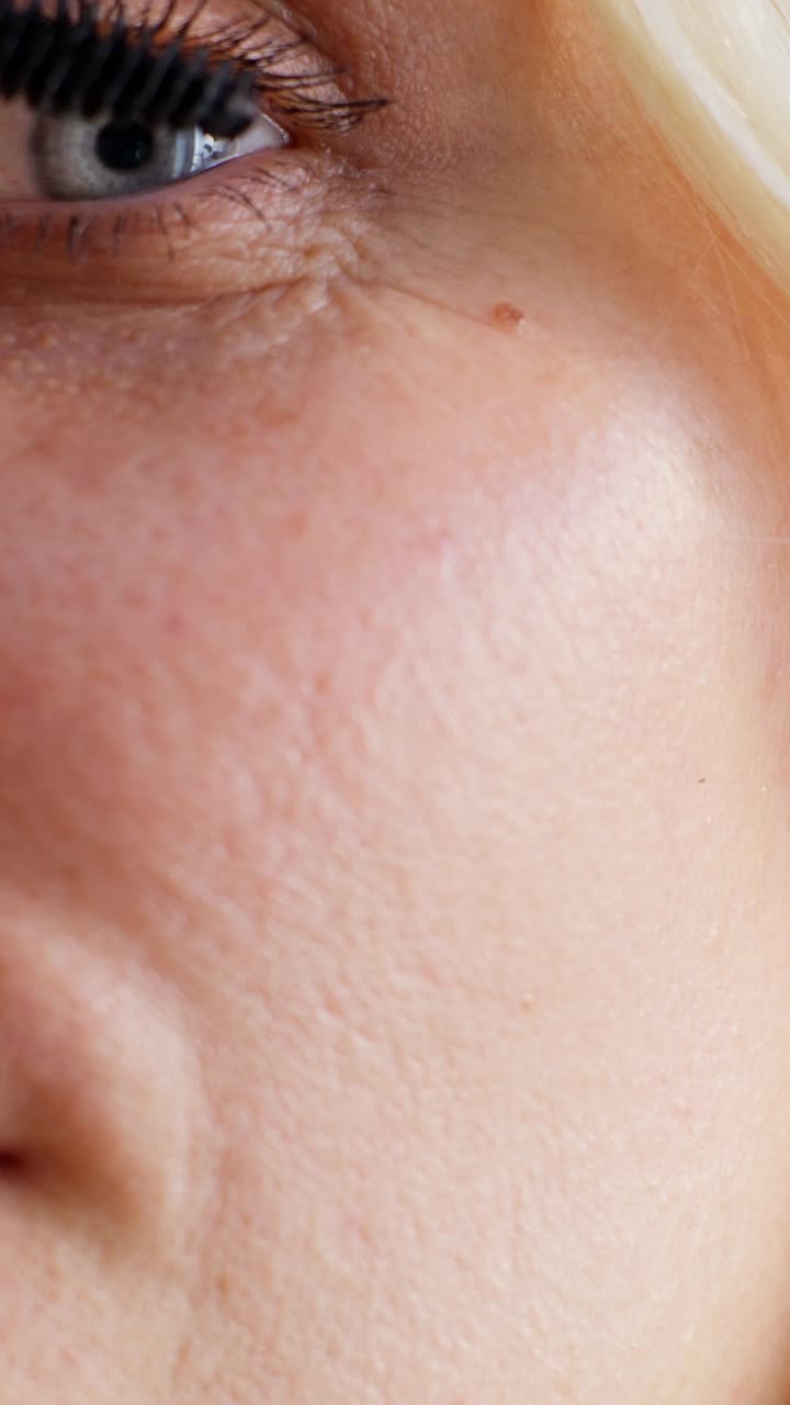 Close-up of a woman's face and makeup application