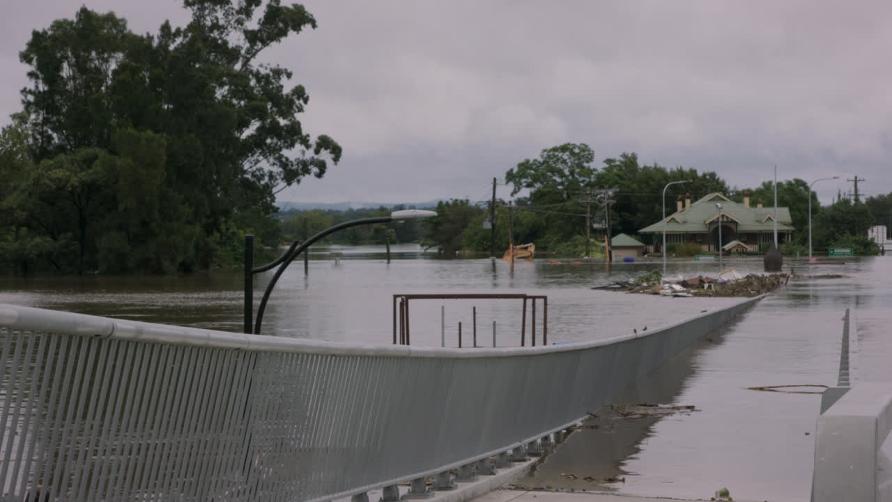 Windsor Bridge disappears into the floodwaters