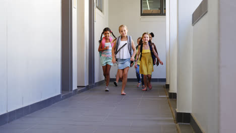 school kids running in corridor