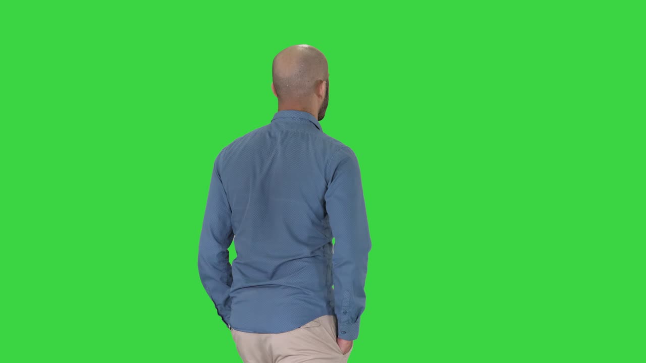Casual young man walking on a Green Screen, Chroma Key