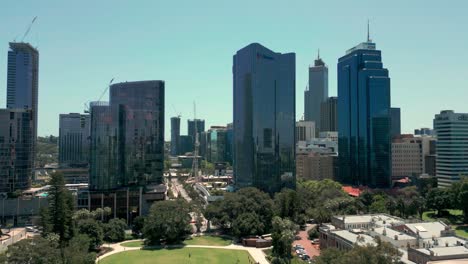 aerial rising shot over perth city downtown skyscrapers, australia